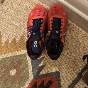 On Running Vibrant Red and Black Athletic Shoes